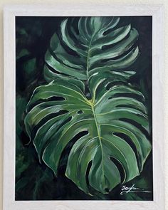 a painting of a large green leaf on a black background with white trim around the edges