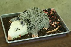 a hedgehog cake sitting on top of a metal pan