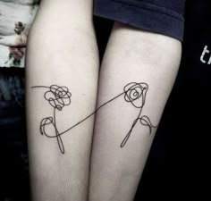 two people with matching tattoos on their legs