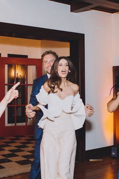 the bride and groom are dancing at their wedding reception