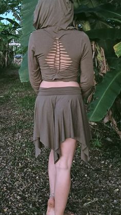 the back of a woman wearing a brown skirt