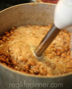 someone is mixing some food in a pot