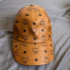 Authentic Mcm Hat, Brand New I Only Wear It To Try On, But Its Too Big For Me. It Comes With Mcm Plastic Bag Only. Pls Check The Pictures And Video For Details. Designer Brown Hat With Short Brim, Designer Brown Brimmed Hat, Luxury Brown Cap, Luxury Brown Brimmed Hat, Luxury Brown Hat With Curved Brim, Designer Brown Baseball Cap, Luxury Brown Hat For Summer, Luxury Brown Summer Hat, Luxury Summer Cap