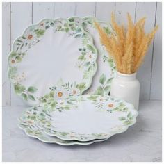 Dimensions: 1" H x 11.2" W x 11.2" D Material: BPA-Free Melamine Color: White, Green, Yellow & Brown Pattern: Floral Care & Safety: Food & Dishwasher Safe; Do Not Microwave Quantity: 4 Give your dining table a touch of country style by setting out Daisies Scalloped Dinner Plates! These charming melamine plates boast a matte finish and feature pretty daisies and green leaves over a white background. Their scalloped edges are perfect for adding some extra texture to your table. Complement your home's farmhouse aesthetic by displaying these darling plates in your dining room! Farmhouse Aesthetic, Melamine Plates, Brown Pattern, Scalloped Edges, Yellow And Brown, Pattern Floral, A White Background, Country Style, White Green