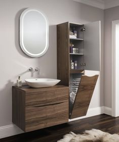 a bathroom with a sink, mirror and cabinet