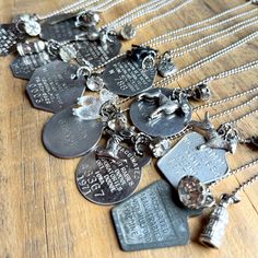 Just what every dog lover needs -- a vintage dog tag necklace! Each necklace includes: * a vintage dog registration tag or rabies vaccine dog tag  * a dog charm * a vintage rhinestone button * all on an adjustable 16"-20" stainless steel ball chain with lobster clasp The dog tags are around 1". These necklaces use one-of-a-kind vintage items so when they're gone... they're gone! But we have lots more available in our shop! Find all our handmade in the USA necklaces here: DuctTapeAndDenim.etsy.com?section_id=6676496 Coffee Necklace, Dog Charm, Dog Necklace, Dog Charms, Upcycled Jewelry, Vintage Dog, Christmas Decorations Ornaments, Cross Earrings, Dog Tag