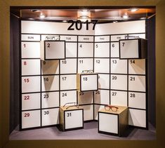 a calendar with glasses on display in front of it