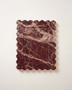 a piece of art that looks like it has been made out of wood and marble