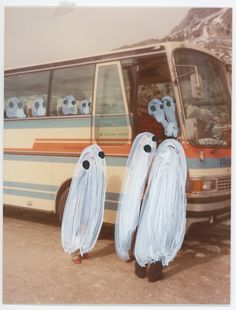 there are three ghost bags in front of the bus