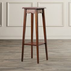 a small wooden table with a shelf on the bottom and one drawer at the top