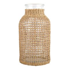 a vase made out of wicker with a clear lid on the top and bottom