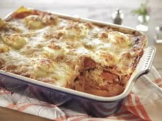 a casserole dish with meat and cheese in it