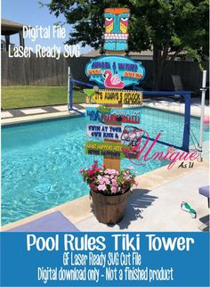 a pool rules tiki tower sign next to a swimming pool with flowers in it