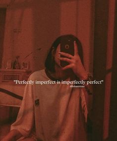 a person taking a selfie in front of a mirror with the caption perfectly imperfectes impecity perfectly perfect