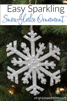 an easy snowflake ornament hanging from a christmas tree with text overlay