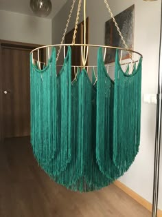 a green chandelier hanging from the ceiling