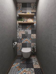 a toilet in a small bathroom with tiled walls and flooring, along with shelving