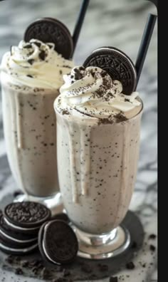 two glasses filled with ice cream and oreo cookies