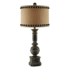 a table lamp with a brown shade on it's base and a beige lampshade