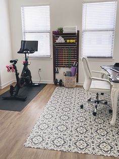 a home office with exercise equipment and yoga mats