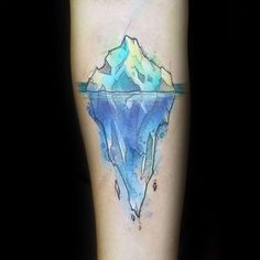 an iceberg tattoo on the leg