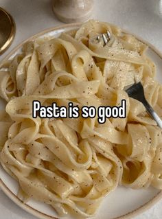 pasta is so good on a plate with a fork