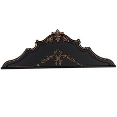 a black and gold shelf with ornate designs on the top, against a white background