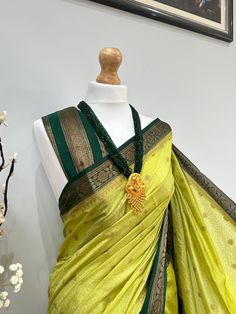 Discover the timeless beauty of our high-quality Banarasi saree, perfect for any occasion(wedding or parties). An apt pick for wedding or any kind of occasion. Very high quality, soft and pleats well. This set is completed with an unstitched blouse fabric. Festive Green Paithani Silk Pre-draped Saree, Festive Green Pre-draped Saree With Zari Weaving, Festive Green Pre-draped Saree With Pallu, Green Paithani Silk Pre-draped Saree With Self Design, Green Pre-draped Saree With Zari Weaving For Diwali, Festive Green Pre-draped Saree With Self Design, Elegant Green Pre-draped Saree For Festivals, Elegant Green Dola Silk Blouse Piece, Semi-stitched Green Saree