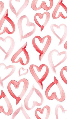 watercolor hearts on white paper with red and pink ink in the shape of letters