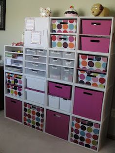 a room filled with lots of pink and white bins