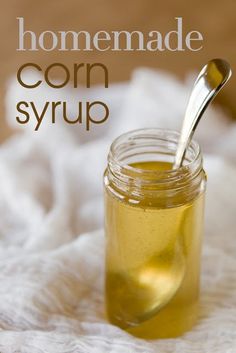 homemade corn syrup in a glass jar with a spoon on the side and text overlay that reads homemade corn syrup