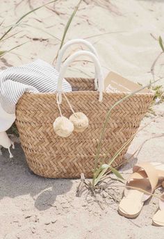 A beach tote you won't want to put down, our signature St. Tropez straw tote is equally at home in the city as on the coast. Toss in your beach towel and sunscreen for weekend getaways, then use it to carry all your daily essentials once you're back home. Handcrafted from all-natural dried woven seagrass straw using a time-honored Filipino basketweaving technique. Features yarn-wrapped handles with coordinating raffia pompoms. Measures 17.5" W by 9.5" H by 5.5" deep with a 4.5" handle drop. Pers 2023 Photoshoot, San Francisco Shopping, Bath And Body Works Perfume, Envelope Clutch Bag, Bag Display, Raffia Bag