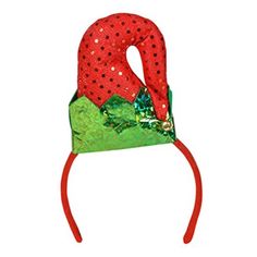 a red headband with green and red polka dots on the top, sitting in front of a white background