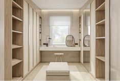 an empty walk - in closet is shown with shelves and stools on the floor