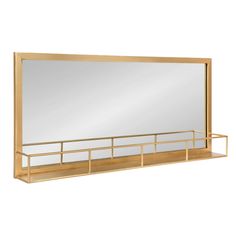 a large mirror sitting on top of a wooden shelf