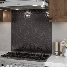 a stove top oven sitting inside of a kitchen next to wooden cabinets and counter tops