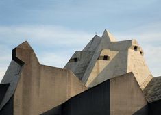 an unusual building made out of concrete blocks