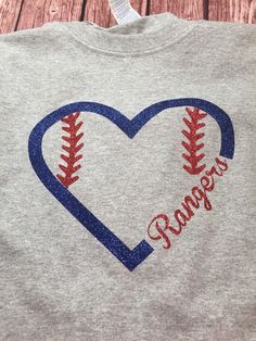 a t - shirt that says rangers with a baseball in the shape of a heart