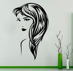 a woman's face with long hair wall decal