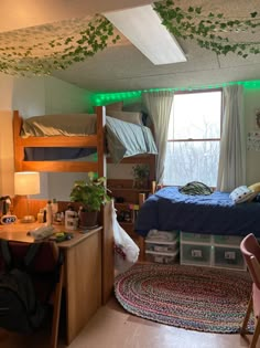 a dorm room with bunk beds and desks