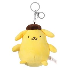 a yellow stuffed animal keychain with a brown hat on it's head