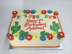 a birthday cake that is decorated with flowers