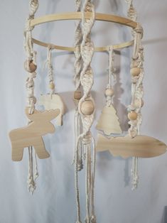 a wind chime made out of wood and rope