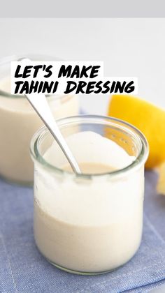 two small glass jars filled with yogurt next to a lemon and a spoon