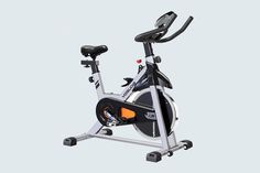 an exercise bike is shown with the seat up and handlebars down on it