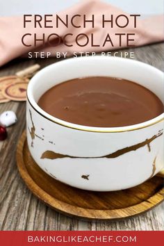 a white bowl filled with chocolate on top of a wooden plate