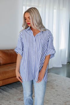 Details: Carleton Striped Button Down Collared Neckline Rolled Short Sleeves One Oversized Chest Pocket Button Down Front Contrast Striped Detailing High-Low Length Lightweight Textured Material No Stretch Oversized/Relaxed Fit Available in Slate Blue Material: 100% Cotton Measurements: Small - Bust: 38" | Length: 29" | Sleeve Length: 8.5" Medium - Bust: 40" | Length: 29.5" | Sleeve Length: 8.5" Large - Bust: 42" | Length: 30" | Sleeve Length: 8.5" *High-Low Length: Add extra 3" to backside for Cotton Shirt With Rolled Sleeves, Shirts Striped, Blue T-shirt With Contrast Stripes, Comfy Sandals, Stylish Sandals, Stylish Boots, Comfortable Flats, Large Bust, Small Bust