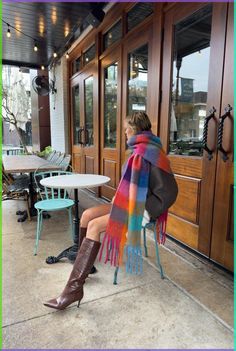 Made from recycled fabric and designed for layering in cold weather the Leah Scarf is our oversized, ultra soft blanket scarf with a colored plaid pattern and loose fringe ends. Wrap the Leah Scarf around once or twice for a luxe, blanketed look. Oversized, mid-weight scarf Multicolored plaid pattern Mixed watercolor hues of orange, green, red, and blue  Loose twisted fringe ends 97% recycled polyester, 3% recycled wool 11.6 inches x 90.5 inches  Accessories are final sale for sanitary purposes. Your order will ship from our warehouse in FL, USA! Colorful Scarf Outfit, Scarf Aesthetic, Winter Nyc, Checkered Scarf, Big Scarf, Rainbow Scarf, Apt Ideas, Oversized Blanket