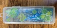 a st patrick's day treat in a plastic container with shamrocks on it