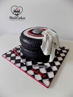 a cake made to look like a car tire on top of a checkered table